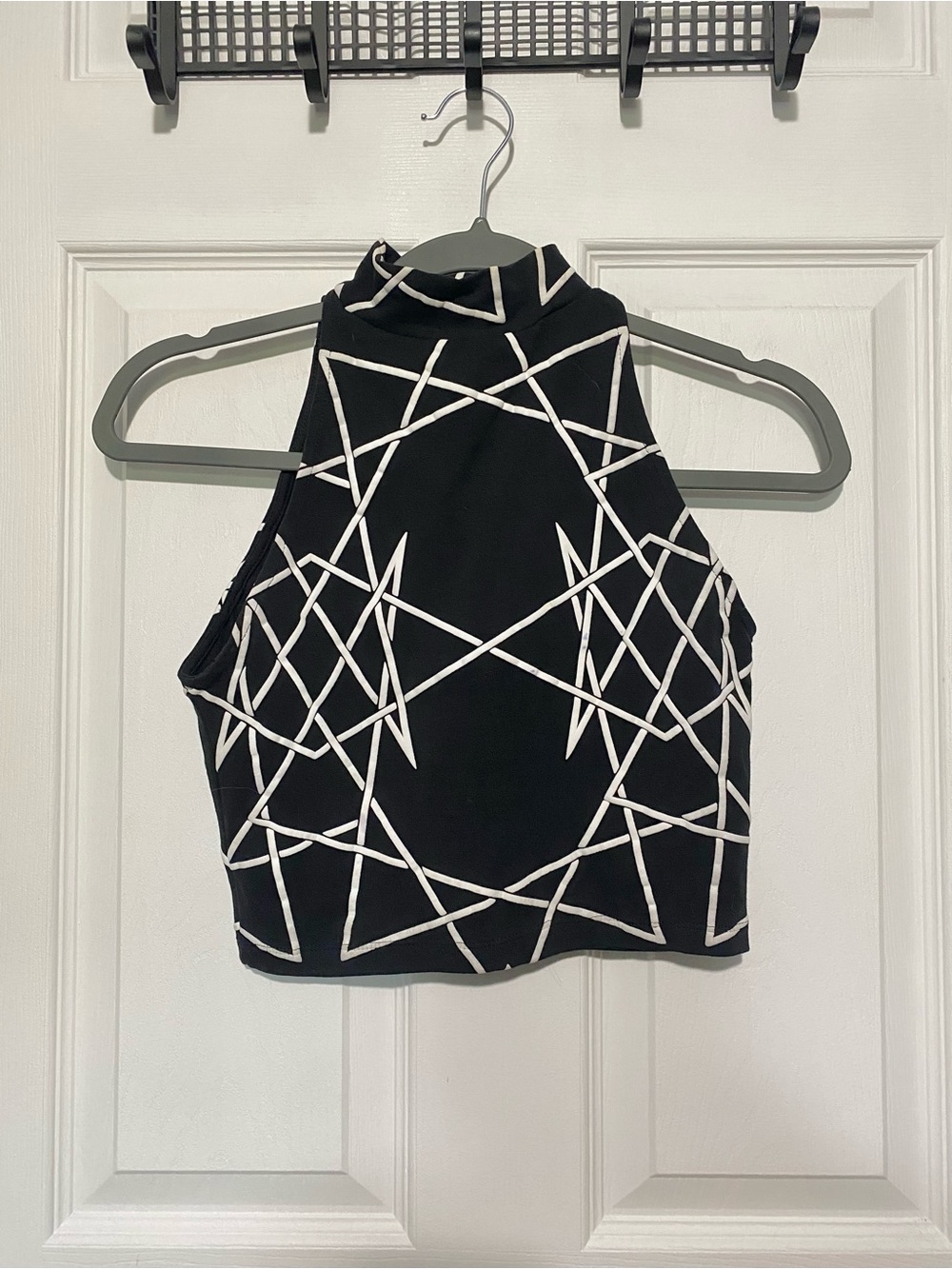 Black Sleeveless Mock Neck Crop Top with White Geometric Pattern